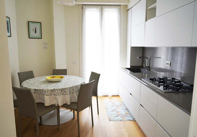 Kitchen and table in apartment